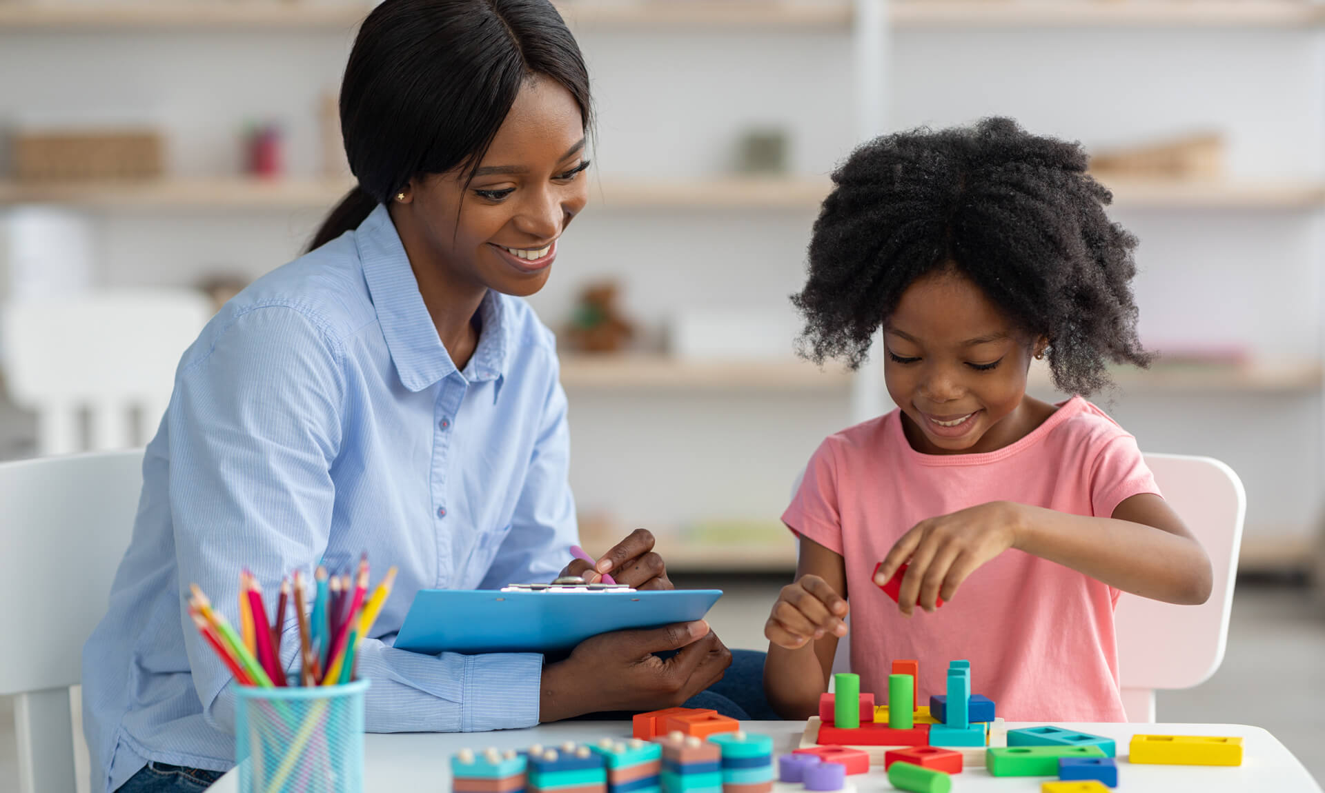 Female therapist working with child in office